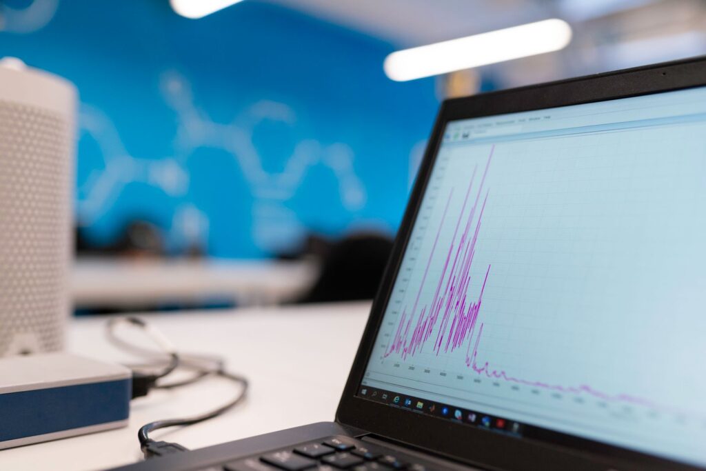 Laptop screen showing an analytics dashboard used to track Google AI Overviews ranking performance
