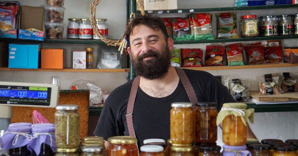Local SEO business: smiling shopkeeper in a local independent store