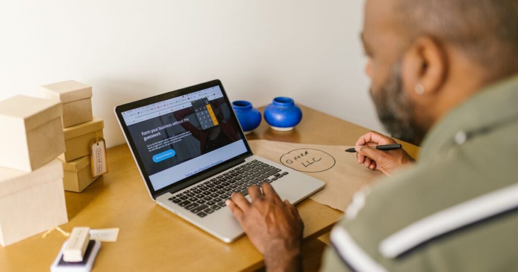 SEO small business packages: small business owner planning at a laptop