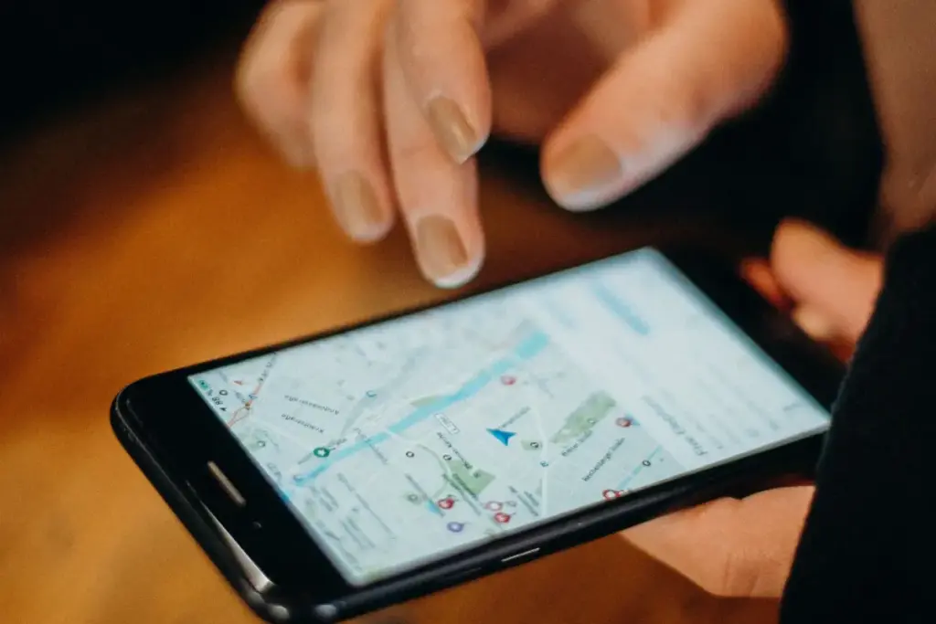 Checking a phone map after learning how to change address on Google Business