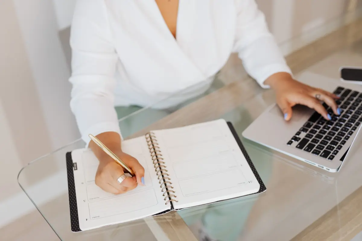 Small business owner preparing website content in a notebook before the build starts