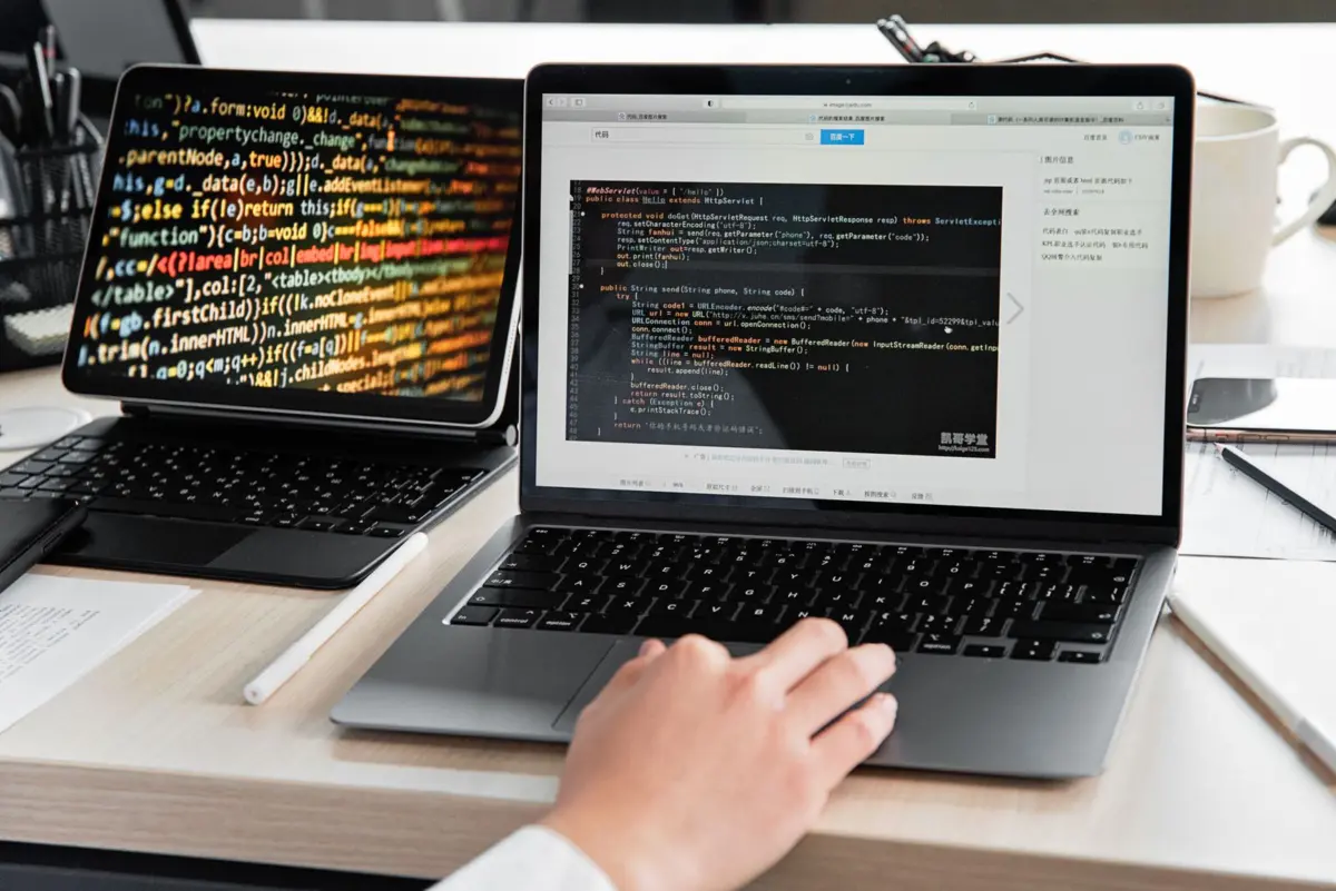 Developer checking website code and settings for a noindex tag blocking Google